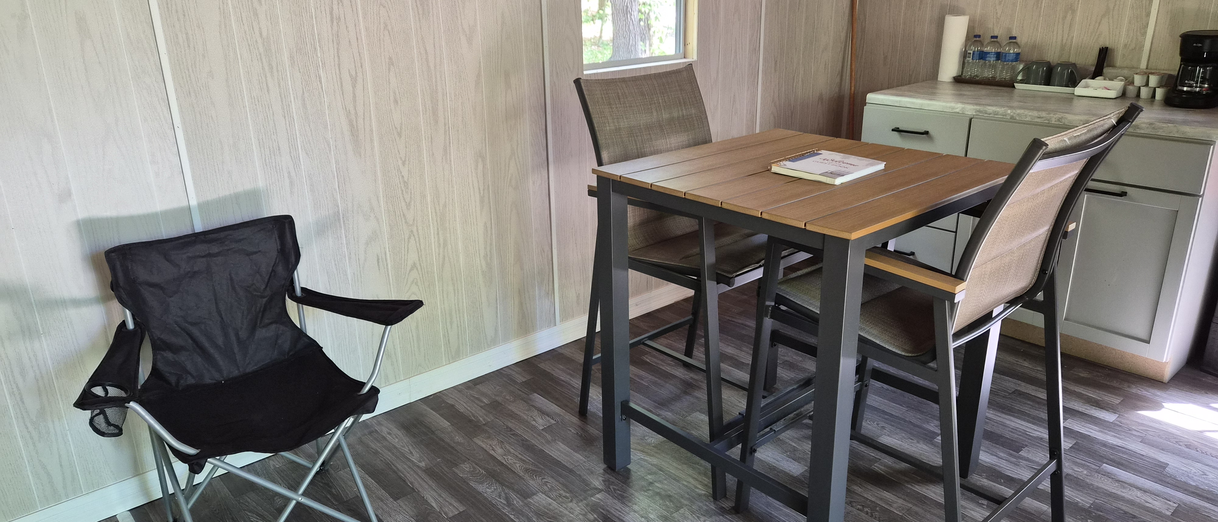 Small dining table and chairs inside the cabin